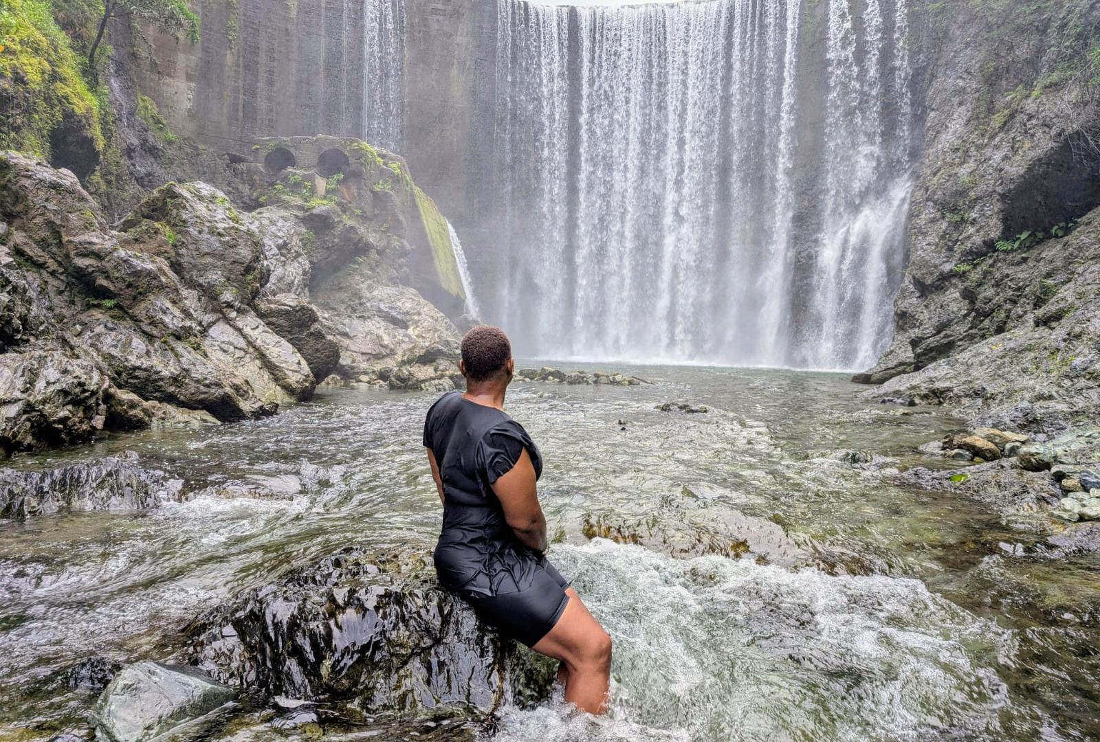 Lush Jamaica landscape — waterfall and rainforest