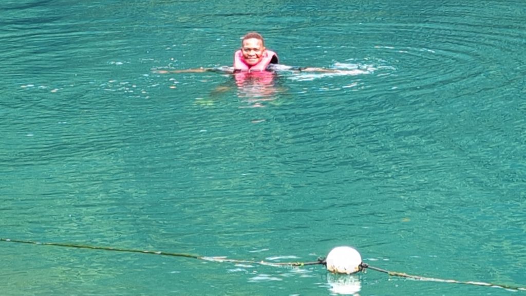 Swimming in Blue Lagoon Jamaica – natural mix of fresh and saltwater.