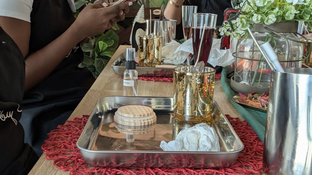 “Guests enjoying a Wick and Sip session, making candles and sipping wine at Wicks by Grey in Kingston”