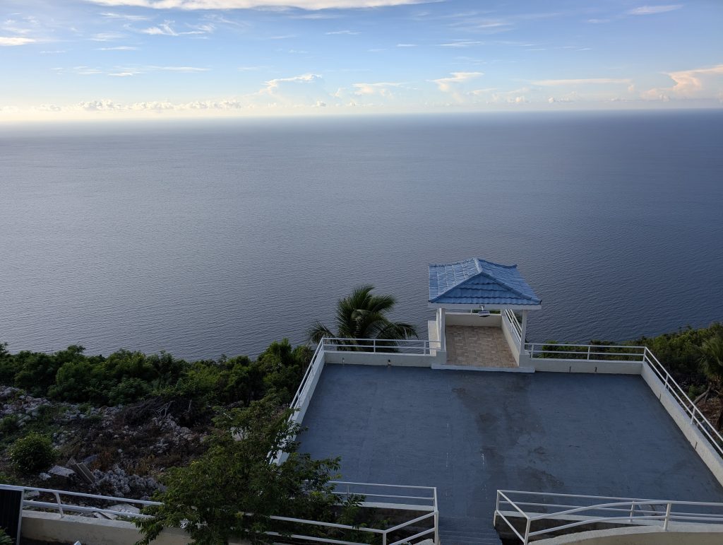 “Rooftop deck at Sea Coast Inn with panoramic ocean views”