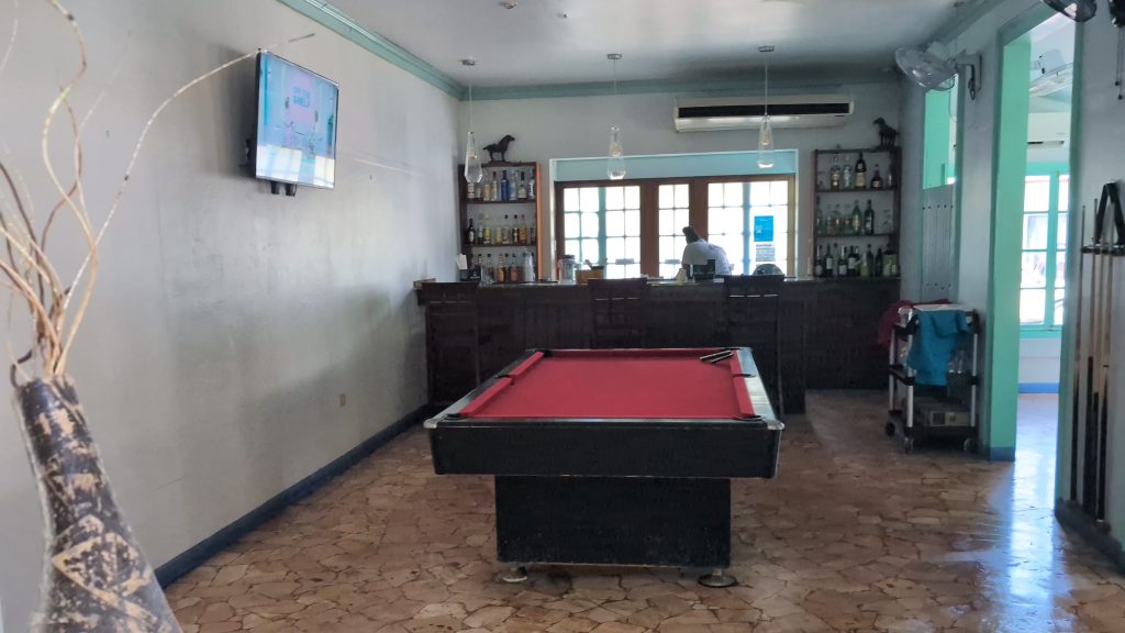 “Toby’s Resort restaurant with pool table and bar seating”